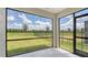 Screened patio with an expansive view of the lush backyard at 17119 Barnwood Pl, Bradenton, FL 34211