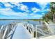 Scenic community dock offering access to the tranquil lake with kayak storage and serene views at 17449 Sandpearl Rd, Venice, FL 34293