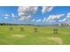 Golf driving range offering practice areas with a view of the lake in a picturesque community setting at 17449 Sandpearl Rd, Venice, FL 34293