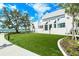 Well-maintained white building with large green lawn and landscaping at 17449 Sandpearl Rd, Venice, FL 34293