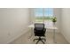 Bright office space featuring a modern desk, chair, and window with natural light, perfect for a productive work environment at 17449 Sandpearl Rd, Venice, FL 34293