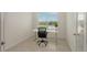 Bright office with a sleek desk and chair, creating a functional workspace at 17449 Sandpearl Rd, Venice, FL 34293
