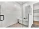 Bright bathroom with a soaking tub and a glass-enclosed shower adjacent to walk-in closet at 17927 Palmiste Dr, Bradenton, FL 34202