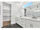 Luxurious bathroom featuring double vanity, quartz countertops, and a large walk-in shower at 17927 Palmiste Dr, Bradenton, FL 34202