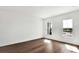 Simple bedroom with hardwood floors, two windows, and white walls, offering a calming space at 17927 Palmiste Dr, Bradenton, FL 34202
