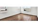Cozy bedroom with hardwood floors and natural light from two windows overlooking backyard at 17927 Palmiste Dr, Bradenton, FL 34202