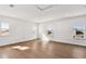 Spacious bonus room with hardwood floors, natural light, and neutral walls at 17927 Palmiste Dr, Bradenton, FL 34202