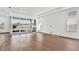 Spacious living room featuring hardwood floors, recessed lighting, and large sliding glass doors at 17927 Palmiste Dr, Bradenton, FL 34202