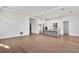Open-concept living room and kitchen features hardwood floors, recessed lighting, and white cabinetry at 17927 Palmiste Dr, Bradenton, FL 34202
