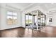 Bright living room features hardwood floors, large windows, and sliding glass doors to the backyard at 17927 Palmiste Dr, Bradenton, FL 34202