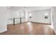 Open loft space with hardwood floors, large windows, and modern railings at 17927 Palmiste Dr, Bradenton, FL 34202