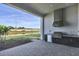 Outdoor kitchen area with built-in grill, storage, and countertop space, perfect for entertaining and enjoying outdoor dining at 17927 Palmiste Dr, Bradenton, FL 34202