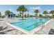 Community lap pool featuring inviting blue water, with a four foot depth, lounge seating, and shade at 17927 Palmiste Dr, Bradenton, FL 34202