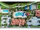 Overhead view showcasing the community pool, tennis courts, and manicured landscaping at 19038 Lappacio St, Venice, FL 34293