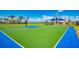 Community basketball court surrounded by mature landscaping and palm trees at 19038 Lappacio St, Venice, FL 34293