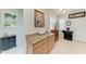 Bright entryway with tile flooring, artful decor and natural light from the window at 19038 Lappacio St, Venice, FL 34293