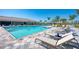 Inviting community pool area with lounge chairs and tables perfect for relaxing and enjoying the sun at 19038 Lappacio St, Venice, FL 34293