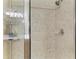 This tiled shower features modern fixtures and a glass door for a sleek, clean look at 19038 Lappacio St, Venice, FL 34293