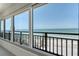Balcony view showcases ocean views with clear blue skies and boats in the distance at 20 Whispering Sands Dr # 1201, Sarasota, FL 34242