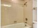 Bathroom shower/tub featuring tiled walls, updated fixtures, offering a clean and stylish space at 20 Whispering Sands Dr # 1201, Sarasota, FL 34242