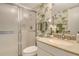 Bathroom featuring green patterned wallpaper, a sink, and shower at 20 Whispering Sands Dr # 1201, Sarasota, FL 34242