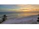 Expansive beach view showing the beautiful shoreline and calm ocean waters at 20 Whispering Sands Dr # 1201, Sarasota, FL 34242
