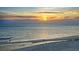 Incredible beach views of the ocean during a sunset with boats and skies ablaze at 20 Whispering Sands Dr # 1201, Sarasota, FL 34242