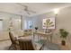 A staged bedroom features a desk, chairs, and artwork at 20 Whispering Sands Dr # 1201, Sarasota, FL 34242
