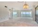 Spacious bedroom featuring mirrored closet doors and balcony access with ocean views at 20 Whispering Sands Dr # 1201, Sarasota, FL 34242