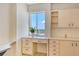 A brightly lit kitchen features lots of cabinet space and a view from the window at 20 Whispering Sands Dr # 1201, Sarasota, FL 34242