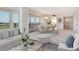 Cozy living room featuring modern furnishings, ocean views, and an open dining area at 20 Whispering Sands Dr # 1201, Sarasota, FL 34242