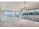 Bright living room with neutral carpet, offering breathtaking views of the ocean, perfect for relaxation and entertainment at 20 Whispering Sands Dr # 1201, Sarasota, FL 34242
