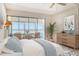 A peaceful main bedroom with balcony access and lots of natural light at 20 Whispering Sands Dr # 1201, Sarasota, FL 34242