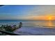 Stunning sunset view over the beach and ocean at 20 Whispering Sands Dr # 1201, Sarasota, FL 34242