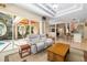 Spacious living room flowing to lanai, featuring stylish seating and tray ceiling at 224 Dahlia Ct, Bradenton, FL 34212