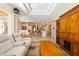 Open-concept living space with stylish furniture and seamless flow to other rooms at 224 Dahlia Ct, Bradenton, FL 34212