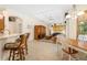 Inviting living room with open layout, bar seating, tray ceiling, and natural light at 224 Dahlia Ct, Bradenton, FL 34212