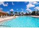 Sparkling community pool offers a refreshing escape, complemented by abundant lounge chairs and shaded seating areas at 224 Dahlia Ct, Bradenton, FL 34212