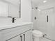 Modern bathroom with a glass-enclosed shower, sleek vanity, and contemporary fixtures at 2655 Bay St, Sarasota, FL 34237