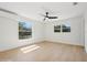 Light filled bedroom with fresh paint, new hardwood floors, two windows and AC at 2655 Bay St, Sarasota, FL 34237