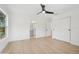 This bedroom has hardwood floors, a large window, and a walk-in closet at 2655 Bay St, Sarasota, FL 34237