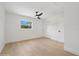 Bedroom features a ceiling fan, hardwood floors, natural light and a closet for storage at 2655 Bay St, Sarasota, FL 34237