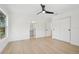 Bright bedroom with hardwood floors featuring ensuite bathroom and double door closet at 2655 Bay St, Sarasota, FL 34237