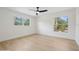 Bright bedroom features hardwood floors, fresh paint, and large windows offering ample sunlight at 2655 Bay St, Sarasota, FL 34237
