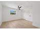 Bright bedroom with hardwood floors and white trim, featuring a ceiling fan at 2655 Bay St, Sarasota, FL 34237