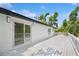 Exterior of a home with a long white deck that wraps around the house at 2655 Bay St, Sarasota, FL 34237