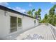 Spacious outdoor deck, perfect for entertaining, with white railings and access to the home's interior at 2655 Bay St, Sarasota, FL 34237