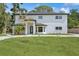 Charming two-story home featuring a well-manicured lawn, modern design, and inviting entrance at 2655 Bay St, Sarasota, FL 34237