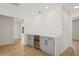 Beautiful living area with hardwood floors, modern cabinets, and an integrated wine cooler at 2655 Bay St, Sarasota, FL 34237