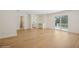 Spacious room with hardwood floors, sliding glass doors to a deck, and neutral walls at 2655 Bay St, Sarasota, FL 34237